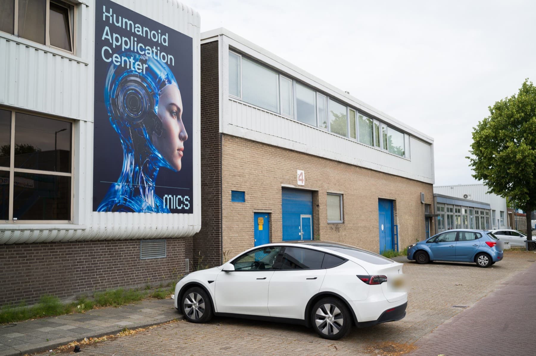 The HAC entrance at Conradstraat 4 in Schiedam, with the large HAC banner on the facade